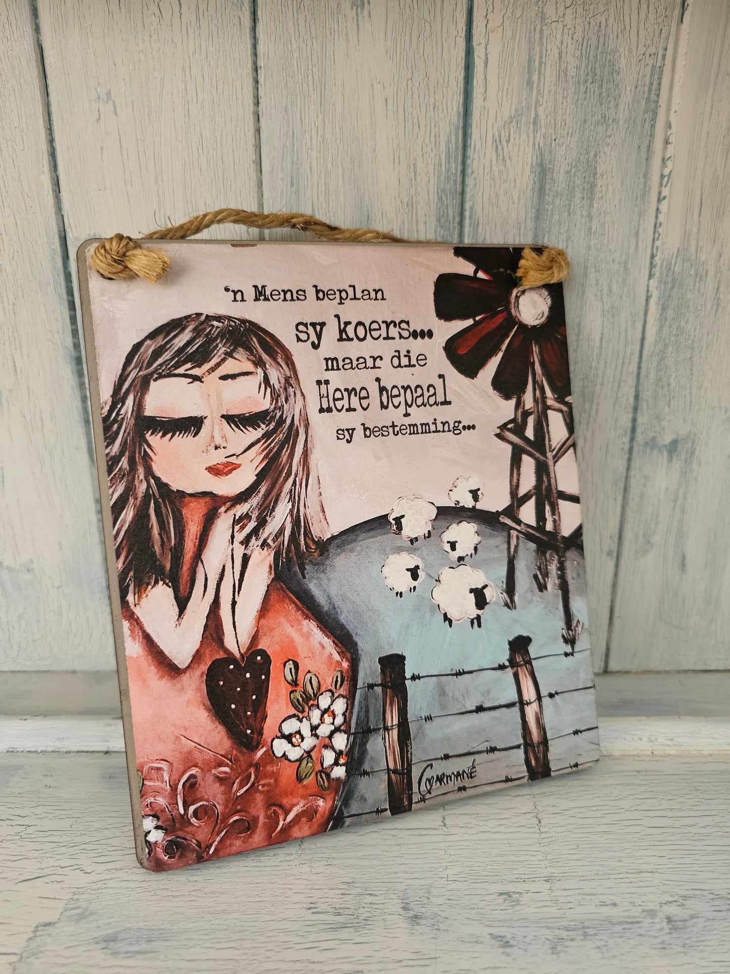 Hanging sign windpomp