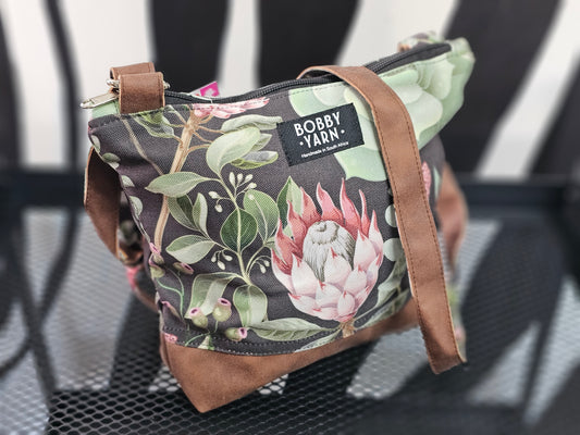 Sling handbag - tan proteas