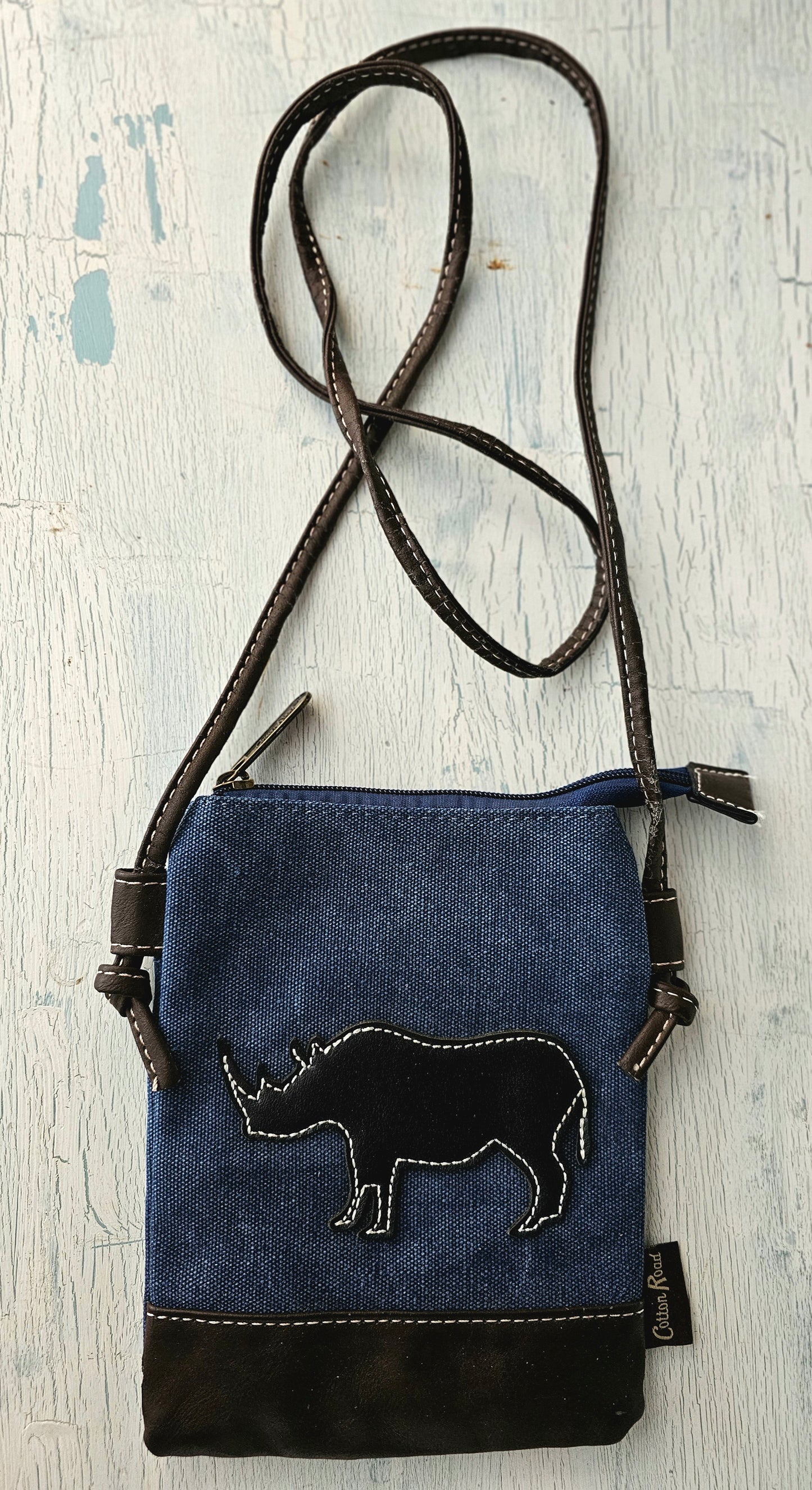 Blue sling bag with Rhino patch